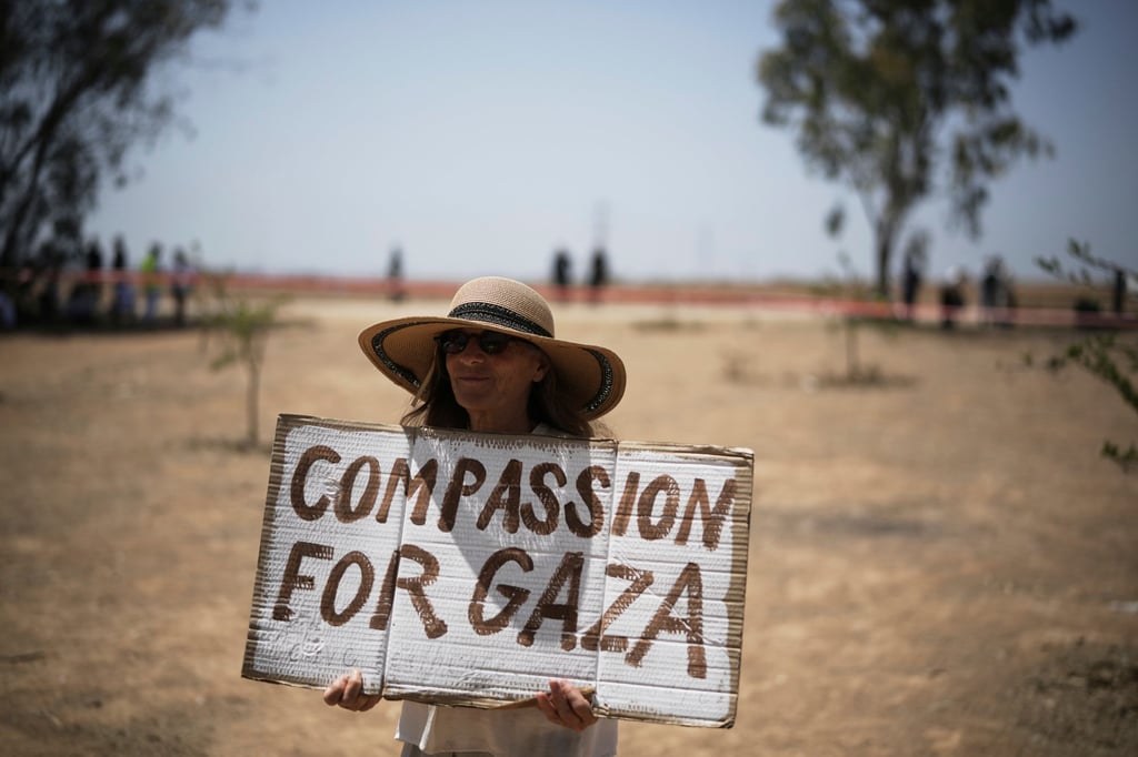 An Israeli woman holds a sign as peace activists march to call for an end to the war and starvation of civilians and the release of all hostages held by Hamas in the Gaza Strip, near the Israel-Gaza border in southern Israel, on Friday. Photo: AP An Israeli woman holds a sign as peace activists march to call for an end to the war and starvation of civilians and the release of all hostages held by Hamas in the Gaza Strip, near the Israel-Gaza border in southern Israel, on Friday. Photo: AP