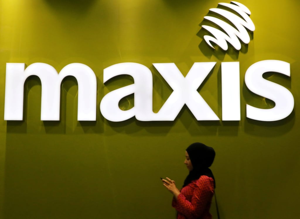A woman walks past a logo of Maxis at its headquarters in Kuala Lumpur. The mobile network operator has already submitted a full report with anonymous data. Photo: Reuters A woman walks past a logo of Maxis at its headquarters in Kuala Lumpur. The mobile network operator has already submitted a full report with anonymous data. Photo: Reuters