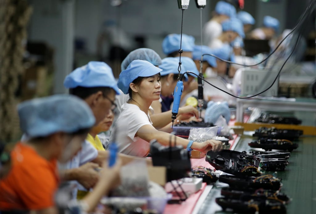 Employees work on the production line of a robot vacuum cleaner factory in Shenzhen, August 9, 2019. Photo: Reuters Employees work on the production line of a robot vacuum cleaner factory in Shenzhen, August 9, 2019. Photo: Reuters