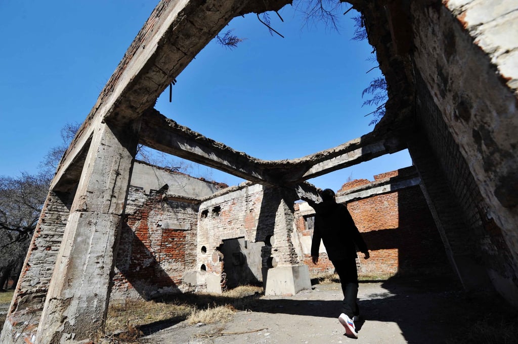 A visitor walks through the ruins of one of Japan’s germ warfare facilities during WWII in China’s northeastern city of Harbin in 2014. Photo: Xinhua A visitor walks through the ruins of one of Japan’s germ warfare facilities during WWII in China’s northeastern city of Harbin in 2014. Photo: Xinhua
