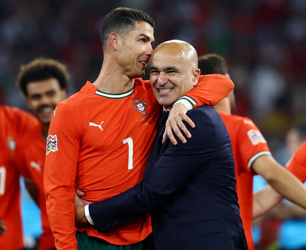 Ronaldo and Portugal coach Roberto Martinez celebrate the Nations League win. Photo: Reuters