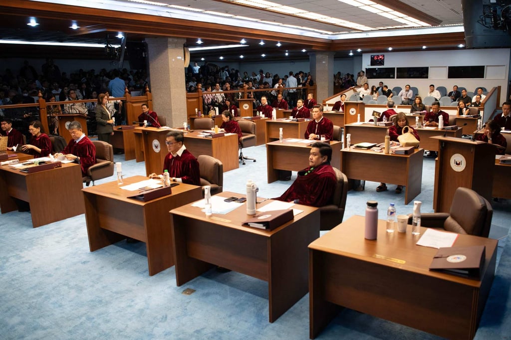 Philippine senators are seated after taking their oath as jurors in the impeachment trial of Vice-President Sara Duterte, in Manila on Tuesday. Photo: AFP