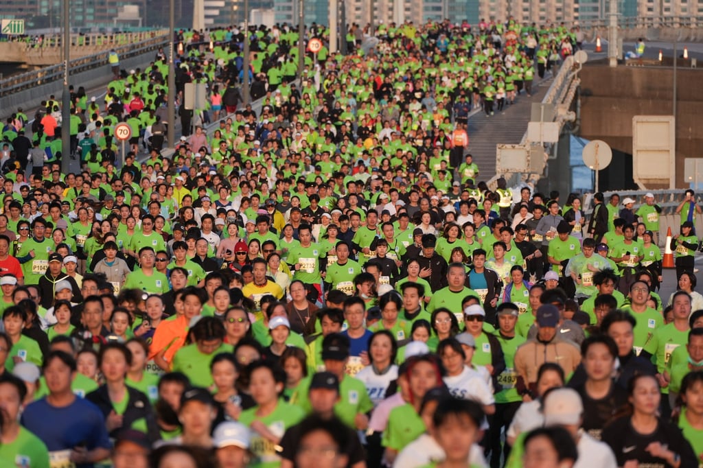 Runners head down the Island Eastern Corridor in North Point during the 10km race during the Standard Chartered Hong Kong Marathon. Photo: Eugene Lee Runners head down the Island Eastern Corridor in North Point during the 10km race during the Standard Chartered Hong Kong Marathon. Photo: Eugene Lee