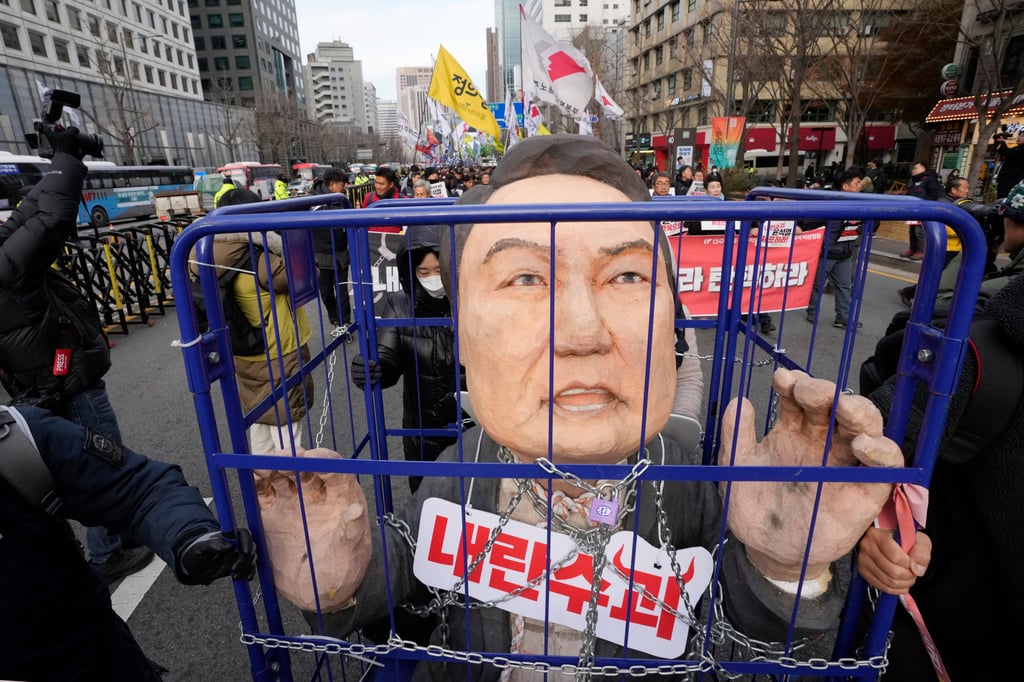 Protesters rallying against then-South Korean president Yoon Suk-yeol in Seoul last December following his failed martial law attempt. Photo: AP Protesters rallying against then-South Korean president Yoon Suk-yeol in Seoul last December following his failed martial law attempt. Photo: AP