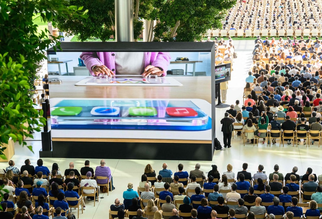 Attendees watch a presentation during the annual WWDC at Apple Park, the corporate headquarters of Apple, in Cupertino, California on Monday. Photo: AFP Attendees watch a presentation during the annual WWDC at Apple Park, the corporate headquarters of Apple, in Cupertino, California on Monday. Photo: AFP