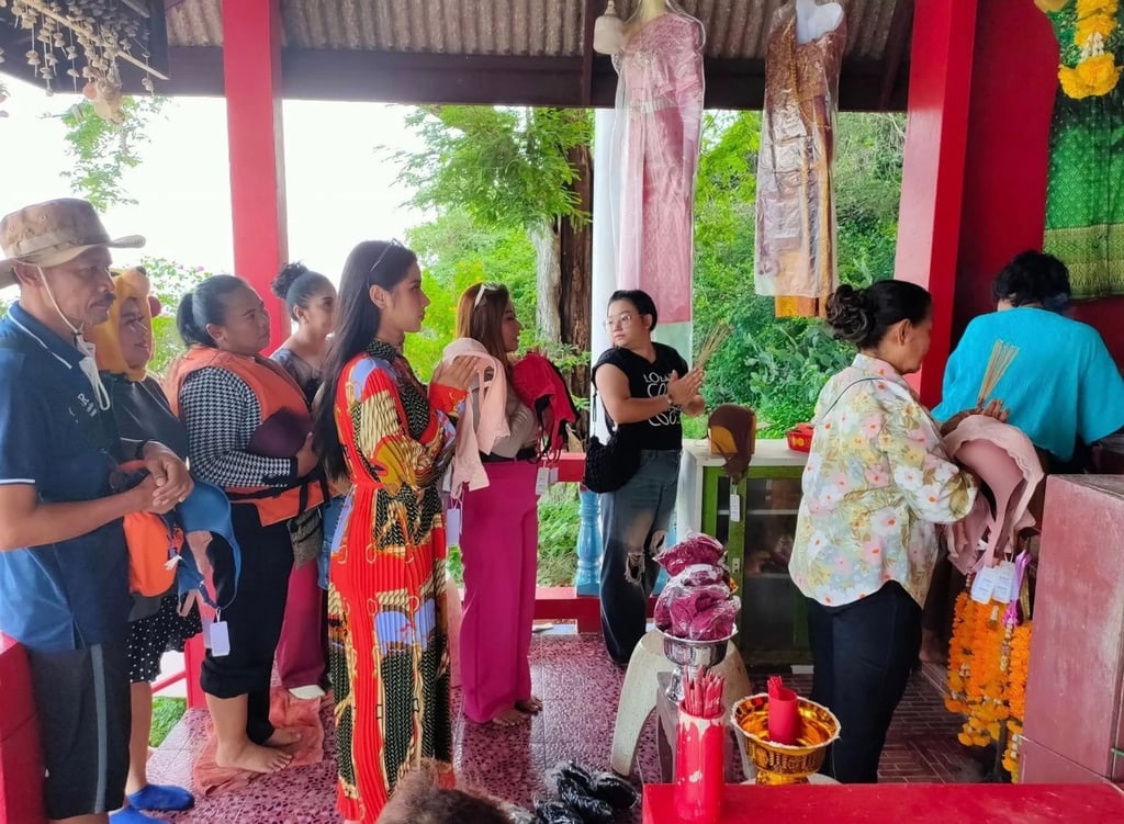 Devotees queue up at the island shrine, bras in hand, to offer thanks for their romantic wishes being granted. Photo: handout Devotees queue up at the island shrine, bras in hand, to offer thanks for their romantic wishes being granted. Photo: handout