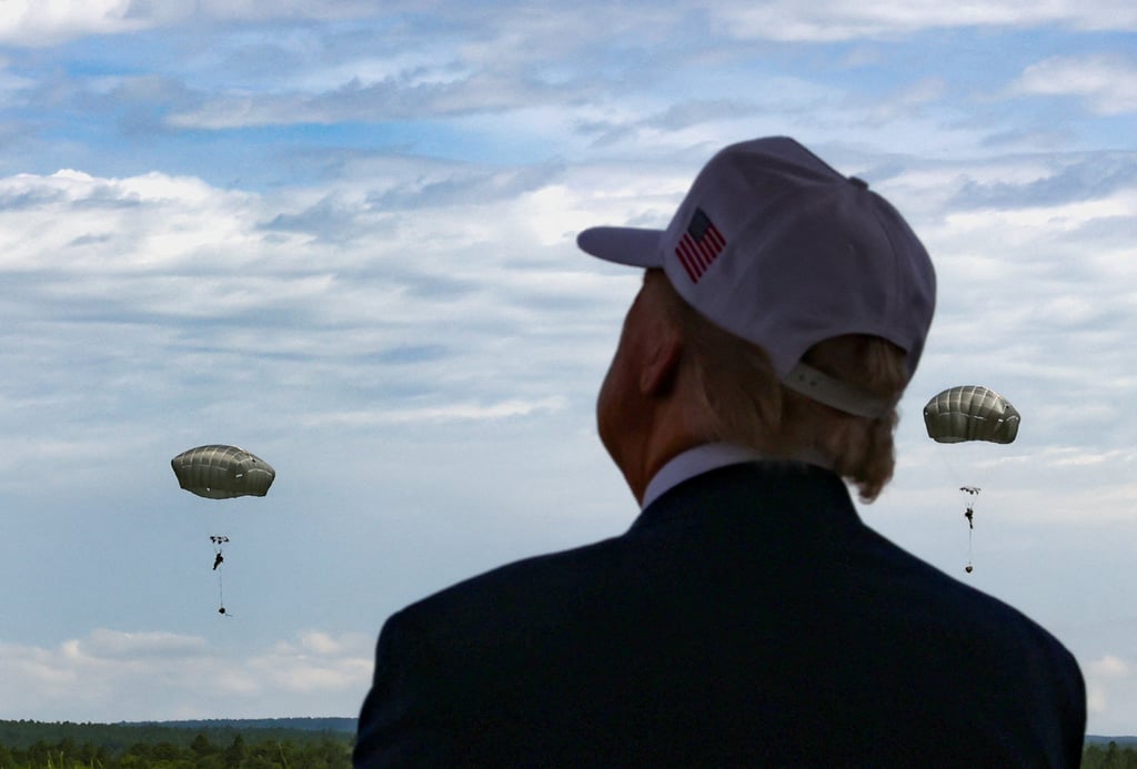 US President Donald Trump watches a military display during a visit to Fort Bragg. Photo: Reuters US President Donald Trump watches a military display during a visit to Fort Bragg. Photo: Reuters