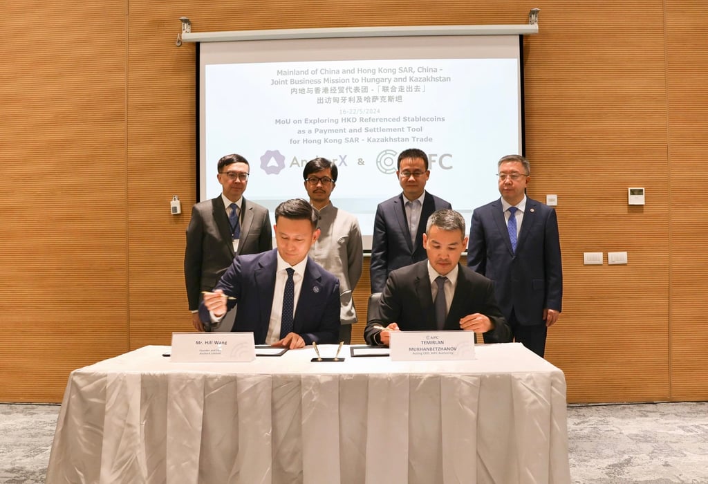 Hill Wang (front, left) signs a memorandum of understanding with Astana International Financial Centre to explore using its stablecoin as a settlement trading tool between Hong Kong and Kazakhstan during a delegation visit organised by the Chinese Ministry of Commerce and Hong Kong’s Belt and Road Office.