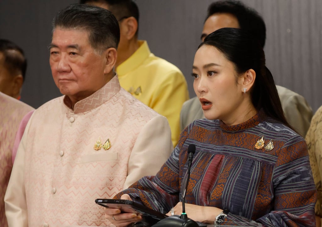 Thai Prime Minister Paetongtarn Shinawatra (right) speaks to the media next to Defence Minister Phumtham Wechayachai at Government House in Bangkok on Tuesday. Photo: EPA-EFE