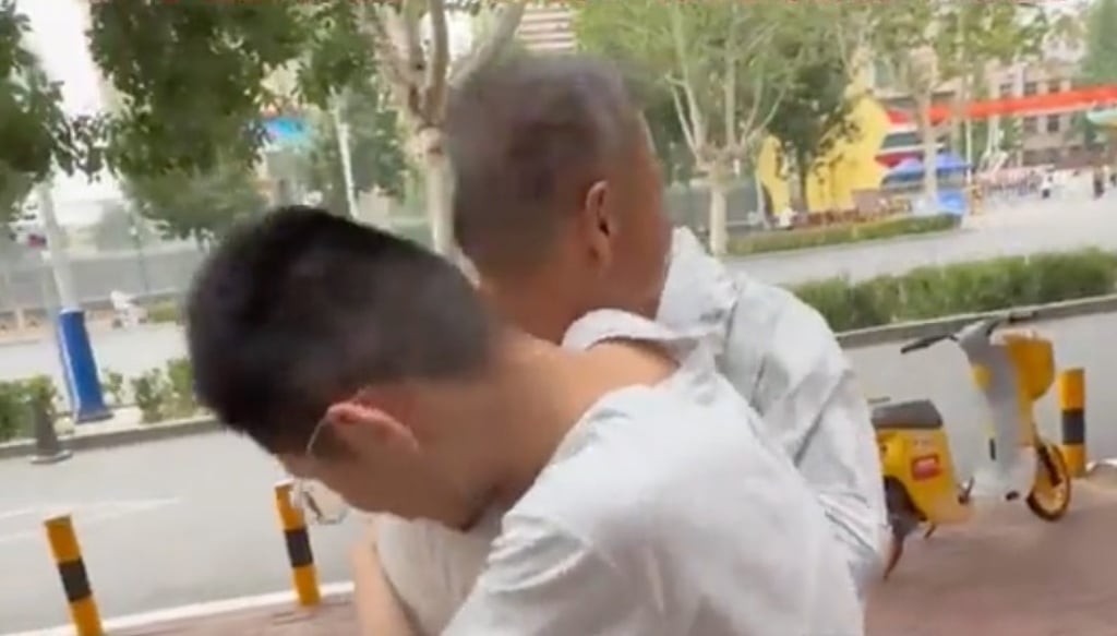 One of the twins gives his grandfather a hug immediately after completing the key test. Photo: Douyin One of the twins gives his grandfather a hug immediately after completing the key test. Photo: Douyin