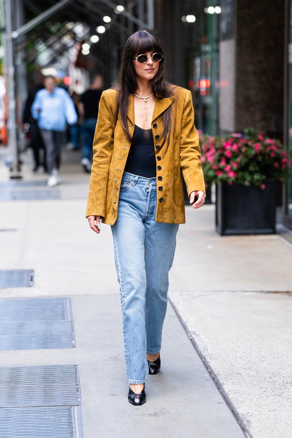 Dakota Johnson wears a jacket and wedges by Khaite in New York, on May 30. Photo: GC Images