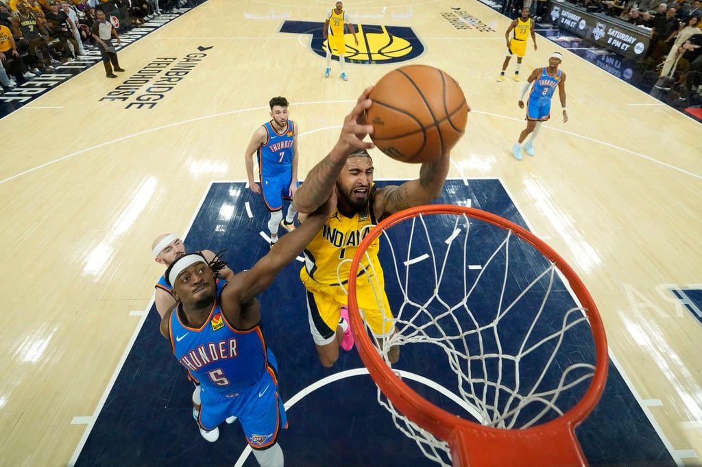 Indiana’s Obi Toppin (centre) dunks over Oklahoma’s Luguentz Dort. Photo: Imagn Images Indiana’s Obi Toppin (centre) dunks over Oklahoma’s Luguentz Dort. Photo: Imagn Images