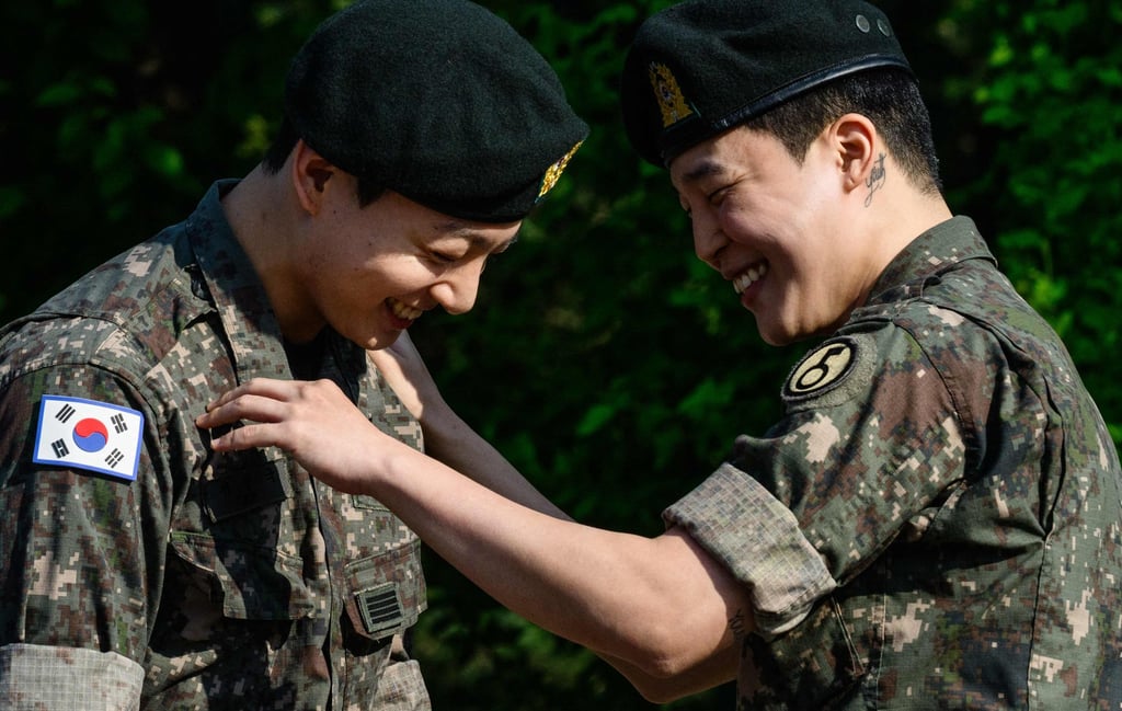 Jungkook (left) and Jimin share a happy moment shortly after their release from 18 months of South Korean military service on Wednesday. Photo: AFP Jungkook (left) and Jimin share a happy moment shortly after their release from 18 months of South Korean military service on Wednesday. Photo: AFP