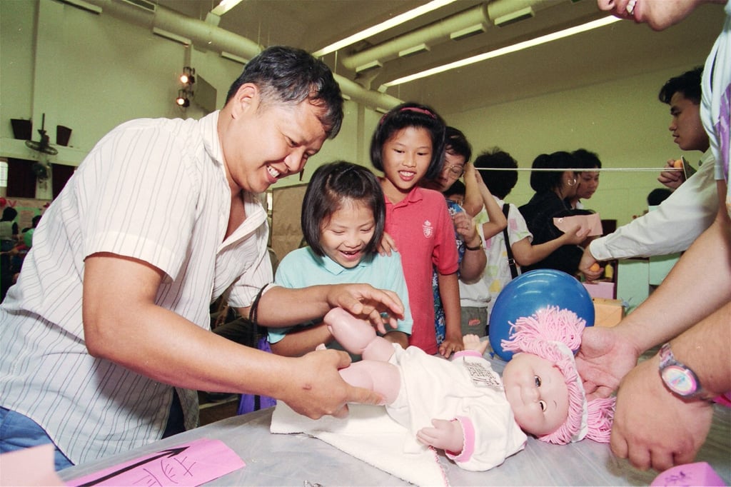 A nappy-changing game at a Father’s Day fête in Chai Wan in 1994. Photo: SCMP Archives