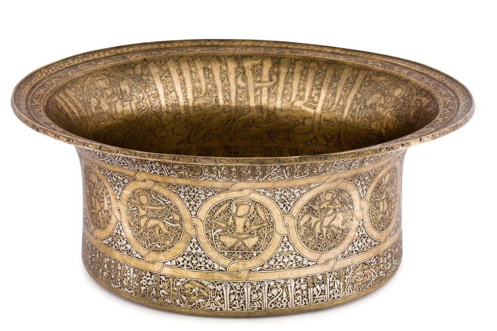 A mid-13th century silver-and-gold-inlaid brass basin, from the Ayyubid dynasty or the Mamluk Sultanate, Syria. Photo: courtesy The Museum of Islamic Art, Doha