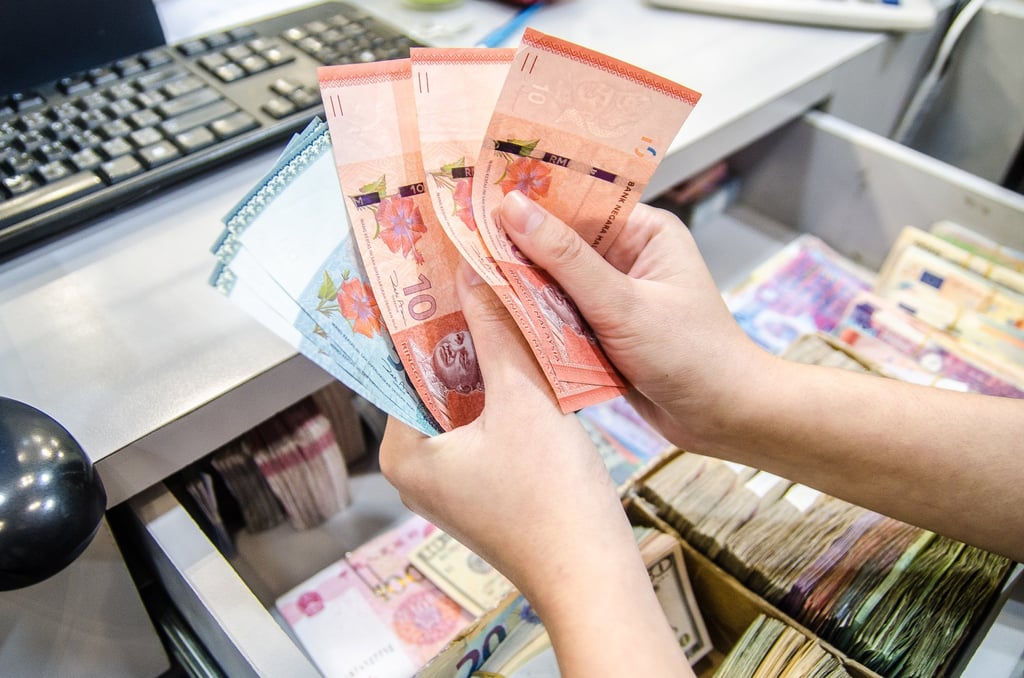 Malaysians face higher costs for goods and homes due to new government taxes. Photo: Shutterstock Malaysians face higher costs for goods and homes due to new government taxes. Photo: Shutterstock