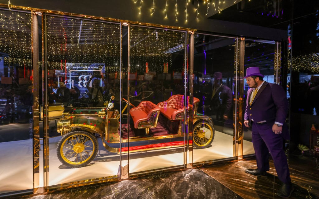 The signature golden Rolls-Royce vintage car of Club Bboss gets the spotlight at the launch of the Big Boss Generation nightspot in Tsim Sha Tsui East. Photo: Nora Tam The signature golden Rolls-Royce vintage car of Club Bboss gets the spotlight at the launch of the Big Boss Generation nightspot in Tsim Sha Tsui East. Photo: Nora Tam