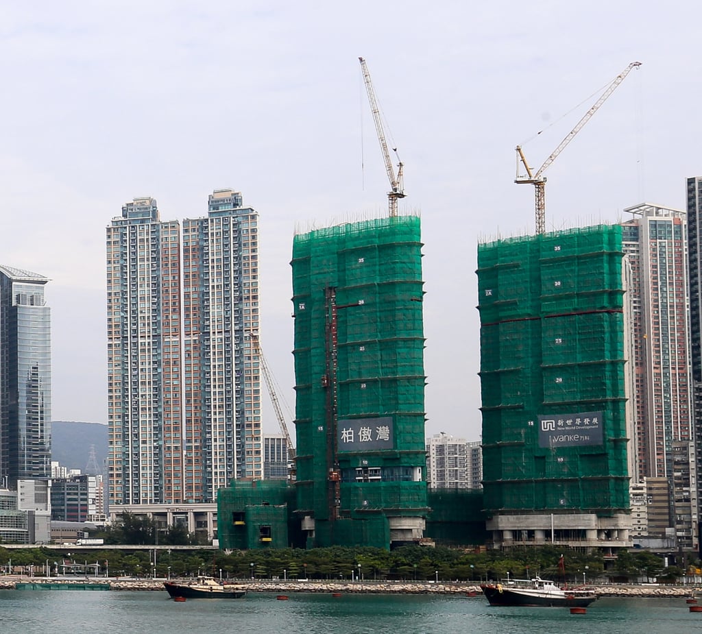 The Deep Water Pavilia luxury residential project, wrapped in green mesh, is being built by a consortium led by New World Development. Photo: Dickson Lee The Deep Water Pavilia luxury residential project, wrapped in green mesh, is being built by a consortium led by New World Development. Photo: Dickson Lee