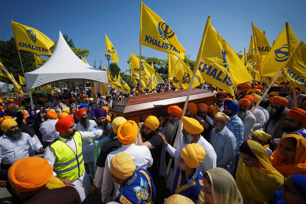 Mourners carry the casket of Sikh community leader and temple president Hardeep Singh Nijjar, in Surrey, British Columbia, June 25, 2023. Photo: AP