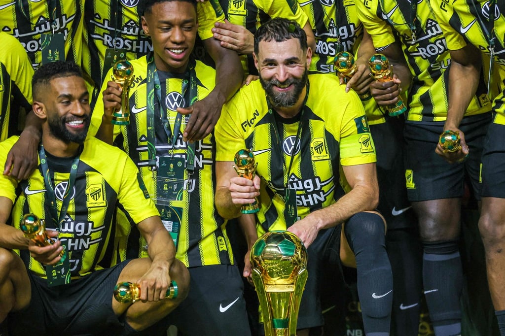 Karim Benzema (front, centre) leads Al-Ittihad celebrations after their King Cup final win. Photo: AFP