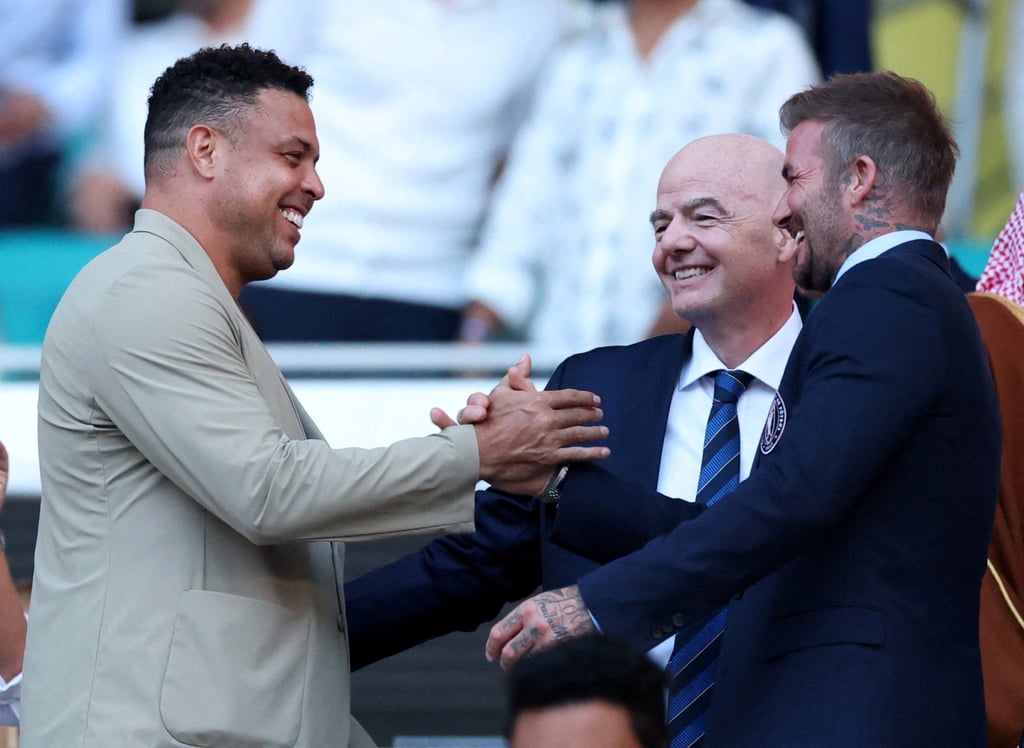 Brazilian legend Ronaldo Nazario (left) shakes hands with Inter Miami president and co-owner David Beckham as Fifa president Gianni Infantino looks on before the opening match. Photo: Reuters