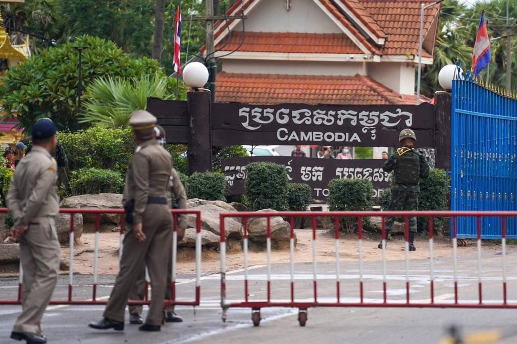 Thai police officers and a soldier stand guard at a border checkpoint with Cambodia last week. Photo: Royal Thai Government / EPA-EFE