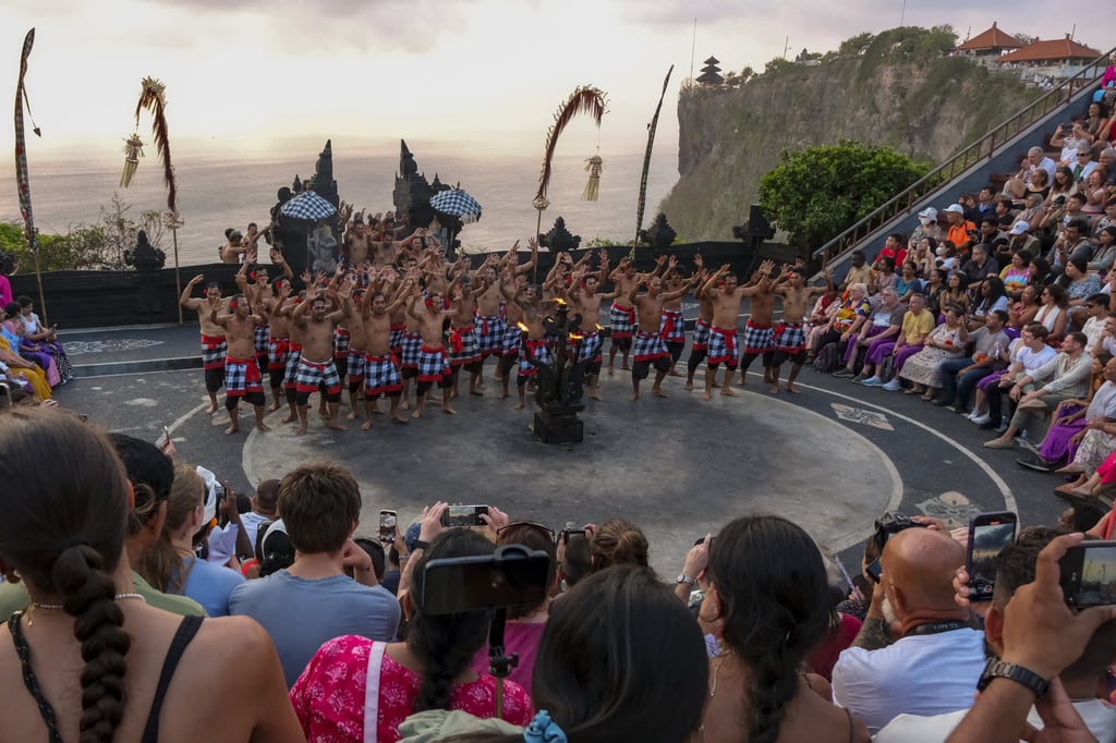 Tourists watch a performance of Bali’s iconic Kecak dance. Photo: Anadolu via Getty Images