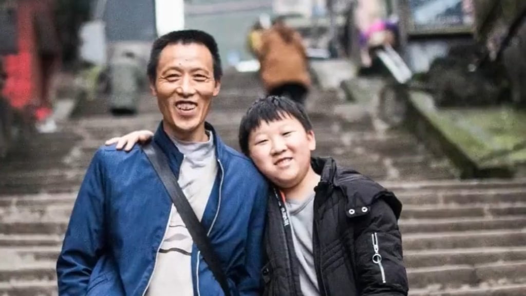 Proud father Ran Guanghui and his now grown-up son, Ran Junchao, are all smiles. Photo: handout Proud father Ran Guanghui and his now grown-up son, Ran Junchao, are all smiles. Photo: handout