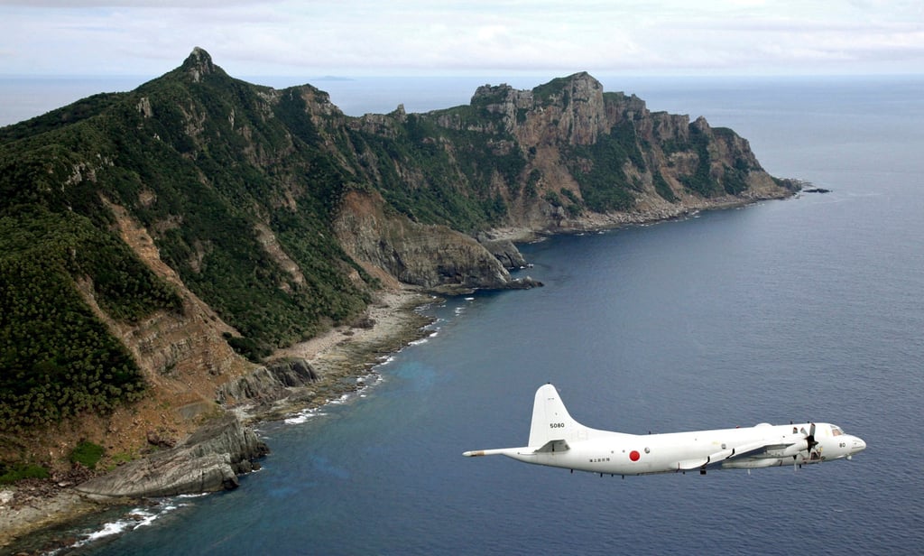 A Japan Maritime Self-Defence Force surveillance plane flies over the disputed Diaoyu Islands. The islands, long a flashpoint in Sino-Japanese ties, are controlled by Tokyo but claimed by Beijing. Photo: AP A Japan Maritime Self-Defence Force surveillance plane flies over the disputed Diaoyu Islands. The islands, long a flashpoint in Sino-Japanese ties, are controlled by Tokyo but claimed by Beijing. Photo: AP