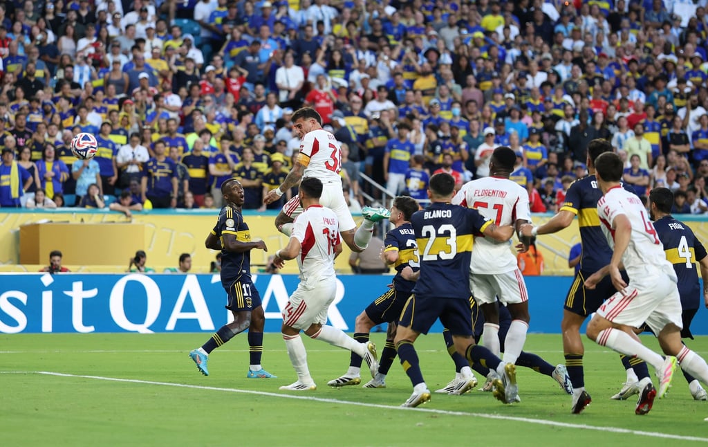 Nicolas Otamendi heads home Benfica’s late equaliser against Boca Juniors. Photo: Xinhua