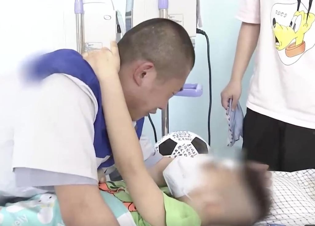 Then prisoner, Yu Haibo, visits his dying son in hospital. At the end of the visit, his frail boy told him to “be good” in jail. Photo: Handout Then prisoner, Yu Haibo, visits his dying son in hospital. At the end of the visit, his frail boy told him to “be good” in jail. Photo: Handout