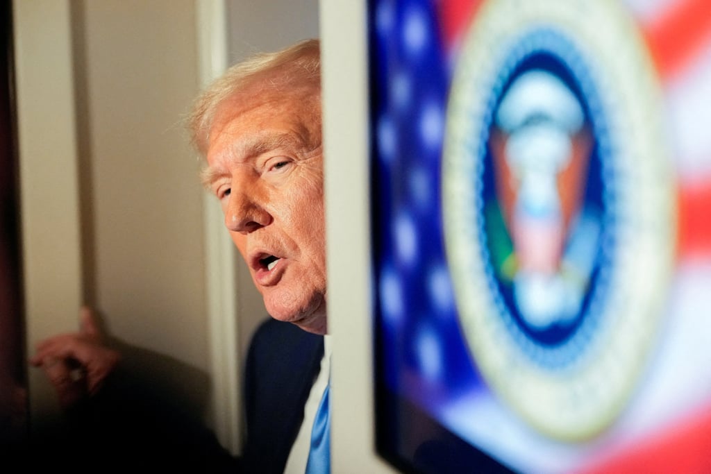 US President Donald Trump talks to members of the press aboard Air Force One. Photo: Reuters US President Donald Trump talks to members of the press aboard Air Force One. Photo: Reuters