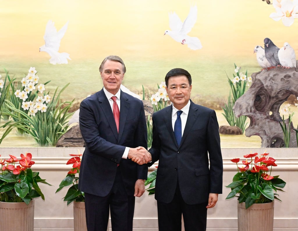China’s Minister of Public Security Wang Xiaohong (right) shakes hands with US ambassador to China David Perdue (left) in Beijing on Thursday. Photo: EPA-EFE/Xinhua China’s Minister of Public Security Wang Xiaohong (right) shakes hands with US ambassador to China David Perdue (left) in Beijing on Thursday. Photo: EPA-EFE/Xinhua