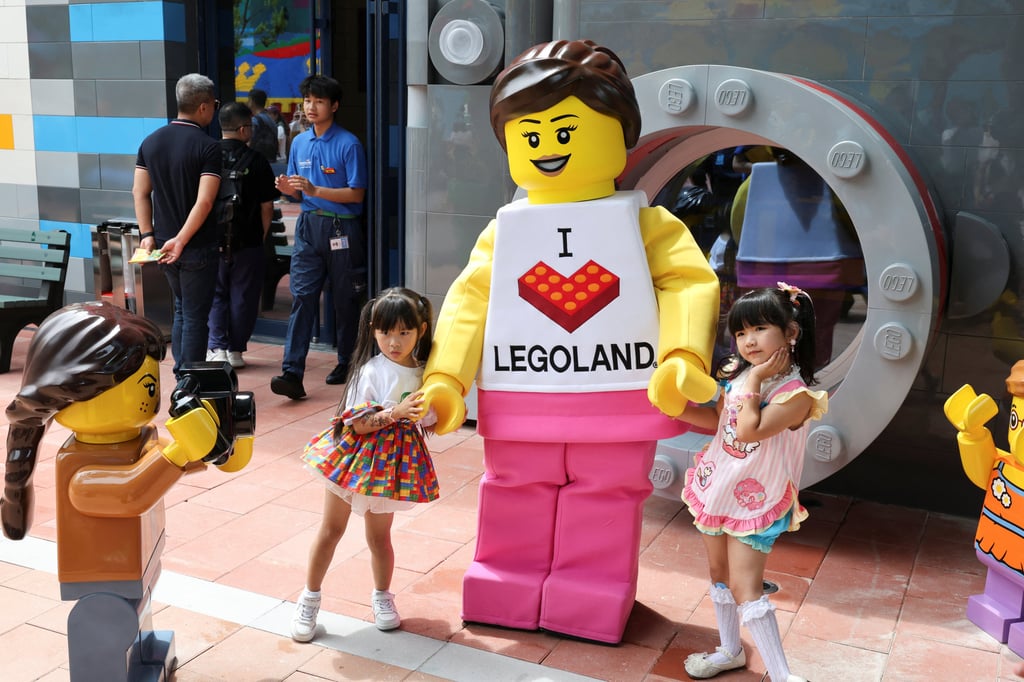 Children pose for a photo with a mascot as they visit Legoland Shanghai Resort ahead of the theme park’s opening on July 5. Photo: Reuters