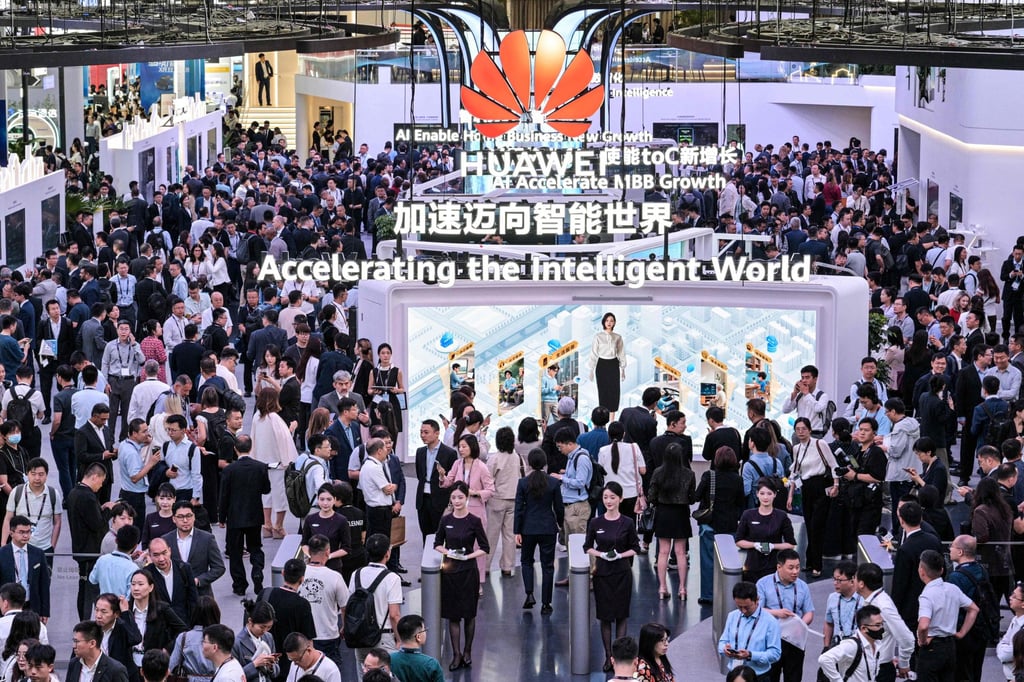 People visit Huawei Technologies’ stand at the opening of the three-day MWC Shanghai trade show on Thursday. Photo: AFP
