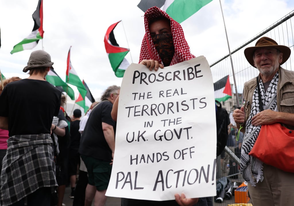 A person holds up a handwritten placard during a demonstration in support of Palestine Action in Trafalgar Square, London, on Monday. Photo: EPA-EFE A person holds up a handwritten placard during a demonstration in support of Palestine Action in Trafalgar Square, London, on Monday. Photo: EPA-EFE