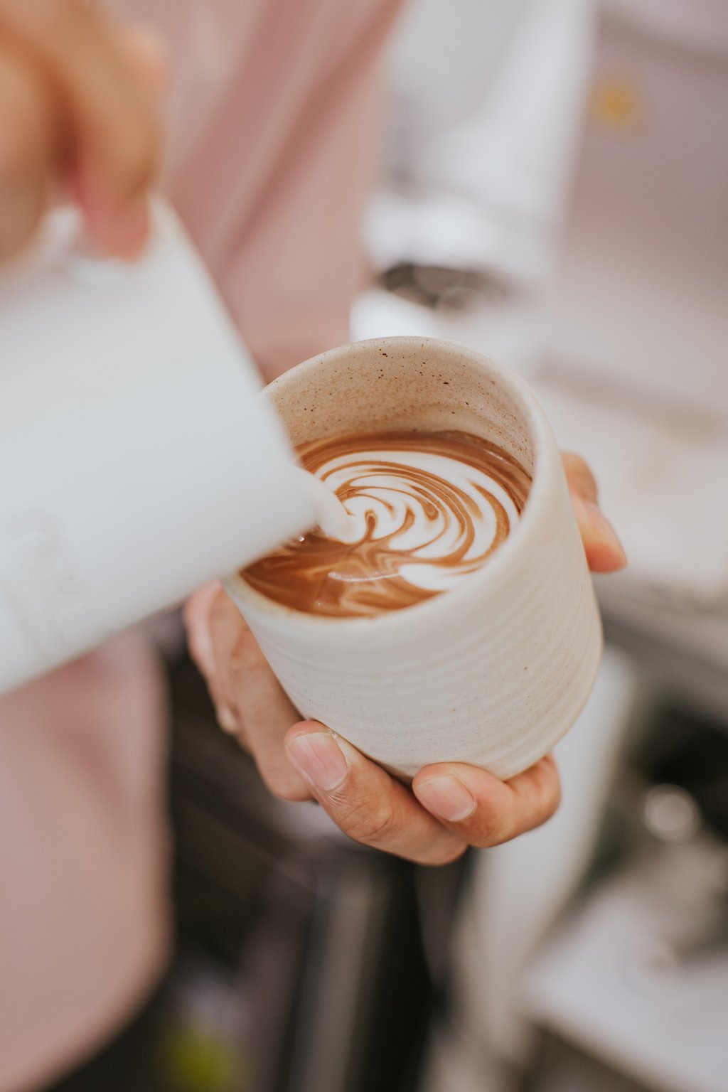 A barista makes latte art at Singapore’s Asylum Coffeehouse. Photo: courtesy Asylum Coffeehouse