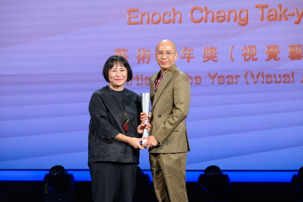 Enoch Cheng (right) receives the artist of the year (visual arts) award from Takahashi Mizuki, executive director at the Centre for Heritage, Arts and Textile, at the 2025 Hong Kong Arts Development Council awards, at Hong Kong City Hall. Photo: Hong Kong Arts Development Council Enoch Cheng (right) receives the artist of the year (visual arts) award from Takahashi Mizuki, executive director at the Centre for Heritage, Arts and Textile, at the 2025 Hong Kong Arts Development Council awards, at Hong Kong City Hall. Photo: Hong Kong Arts Development Council