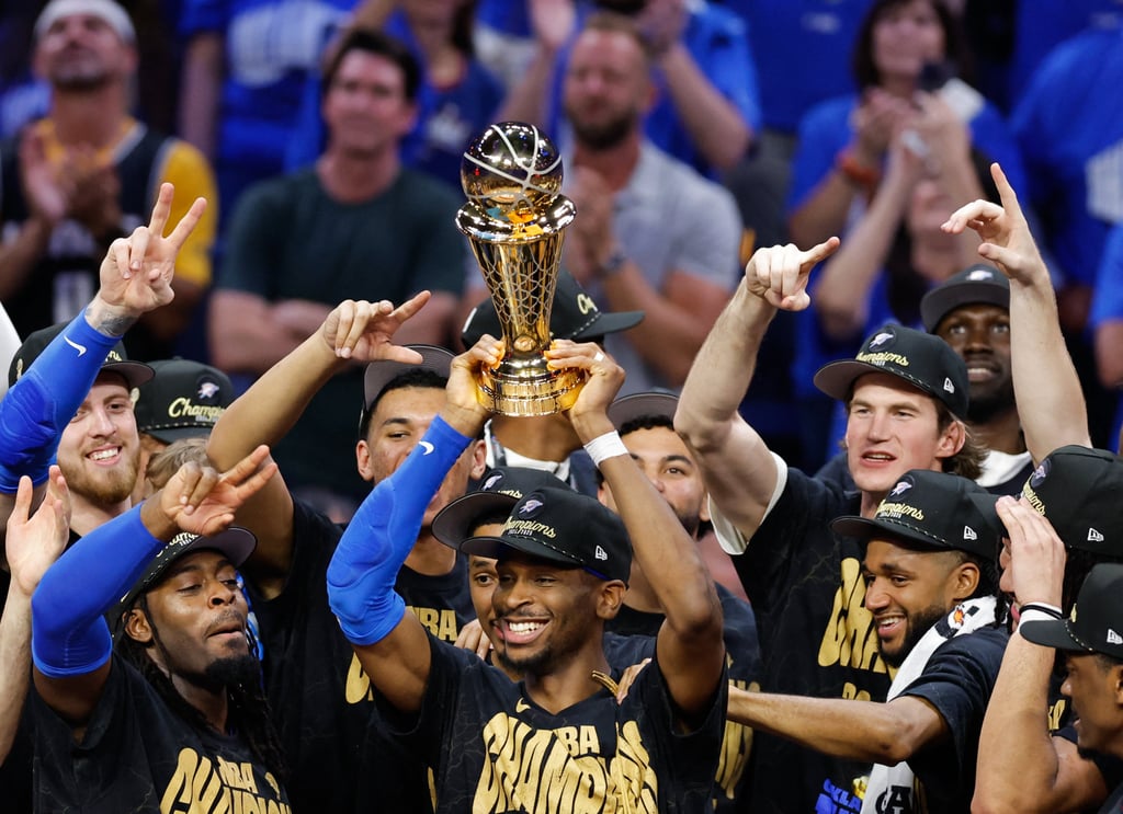Shai Gilgeous-Alexander lifts the championship trophy. Photo: Imagn Images via Reuters Connect