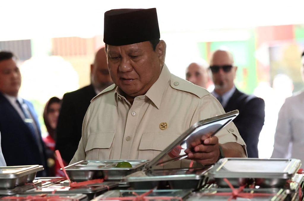 Indonesian President Prabowo Subianto takes a closer look at the meals on offer during a visit to a school in Jakarta to inspect the free nutritious meals programme in May. Photo: Reuters Indonesian President Prabowo Subianto takes a closer look at the meals on offer during a visit to a school in Jakarta to inspect the free nutritious meals programme in May. Photo: Reuters