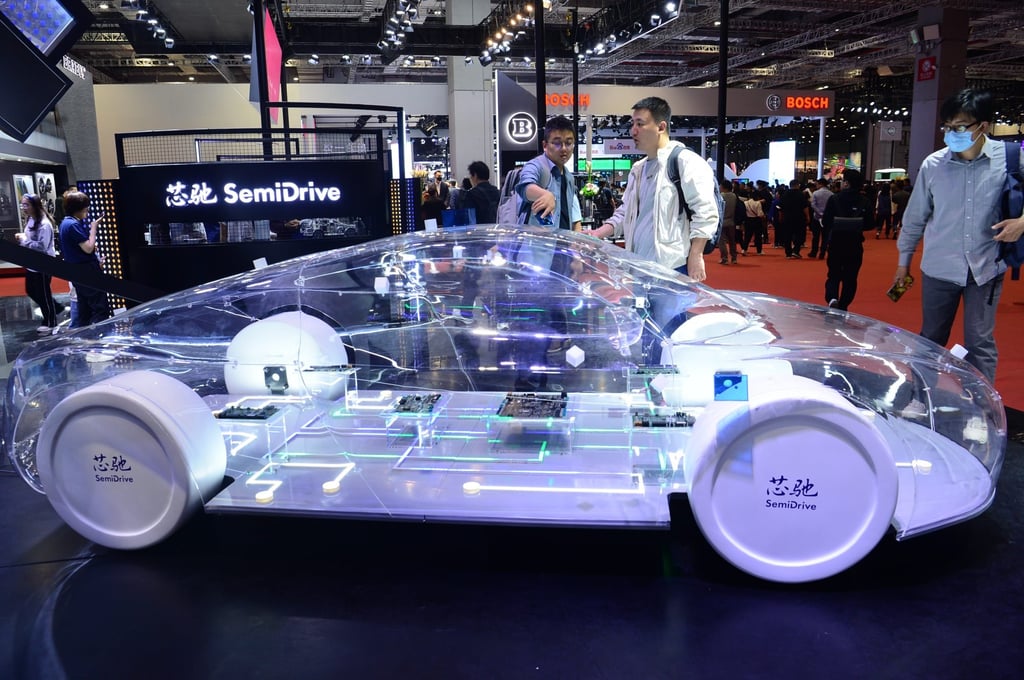 Visitors look at a display at the booth of SemiDrive Technology at the 2023 Shanghai Auto Show. Photo: Getty Images Visitors look at a display at the booth of SemiDrive Technology at the 2023 Shanghai Auto Show. Photo: Getty Images