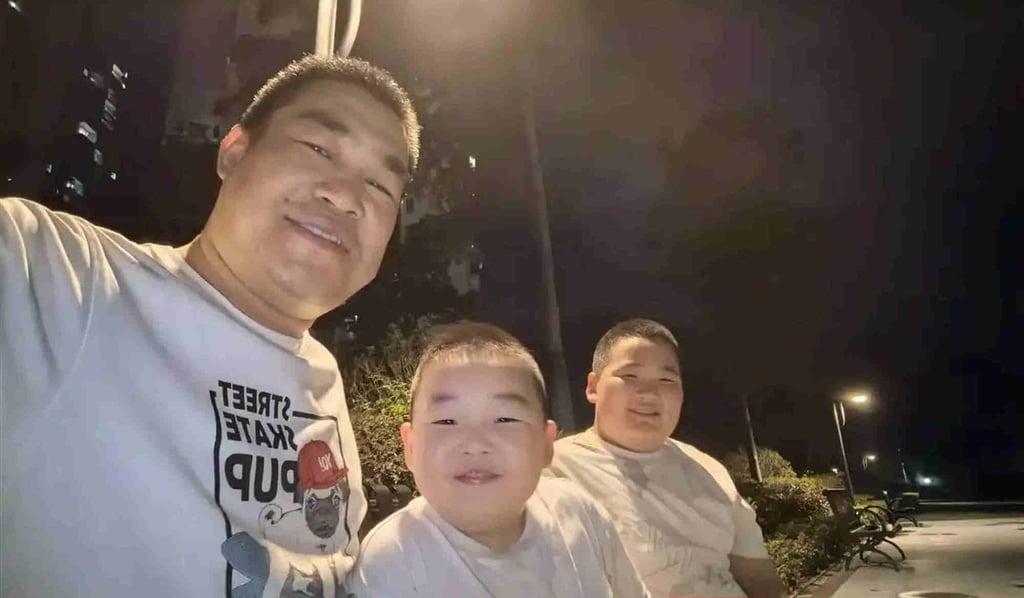 Seeing the funny side: The father and sons outside after their video went viral on social media. Photo: Baidu Seeing the funny side: The father and sons outside after their video went viral on social media. Photo: Baidu