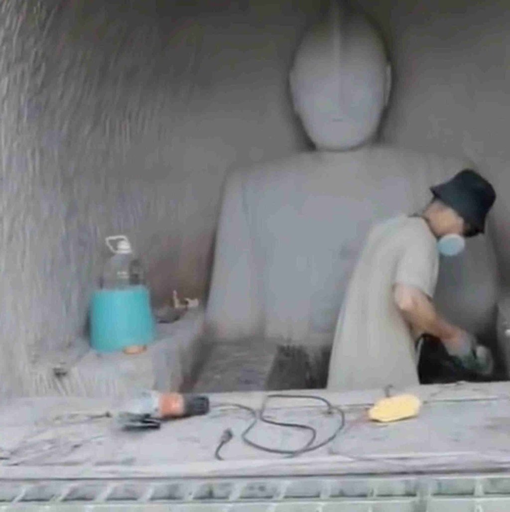 Zhou pictured working as his creation begins to take shape on the cliffside. Photo: Weibo Zhou pictured working as his creation begins to take shape on the cliffside. Photo: Weibo