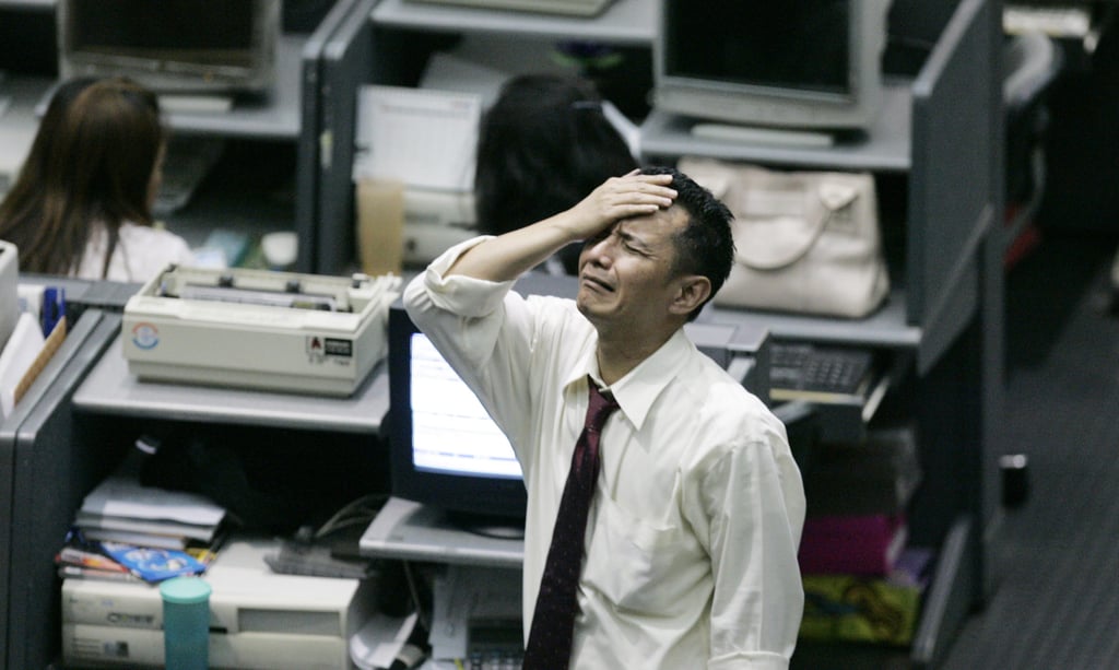 A trader reacts on the trading floor of the Indonesia Stock Exchange in Jakarta on October 8, 2008, after Indonesia’s benchmark stock index plunged 10 per cent on fears about the global financial crisis. Photo: AP