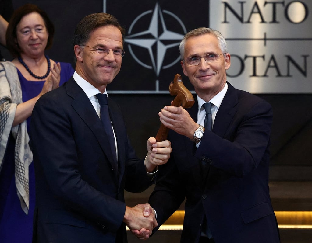 Jens Stoltenberg (right) shakes hands with the new Nato Secretary General Mark Rutte at the alliance’s headquarters in Brussels on October 1, last year. Photo: ReutersY Jens Stoltenberg (right) shakes hands with the new Nato Secretary General Mark Rutte at the alliance’s headquarters in Brussels on October 1, last year. Photo: ReutersY