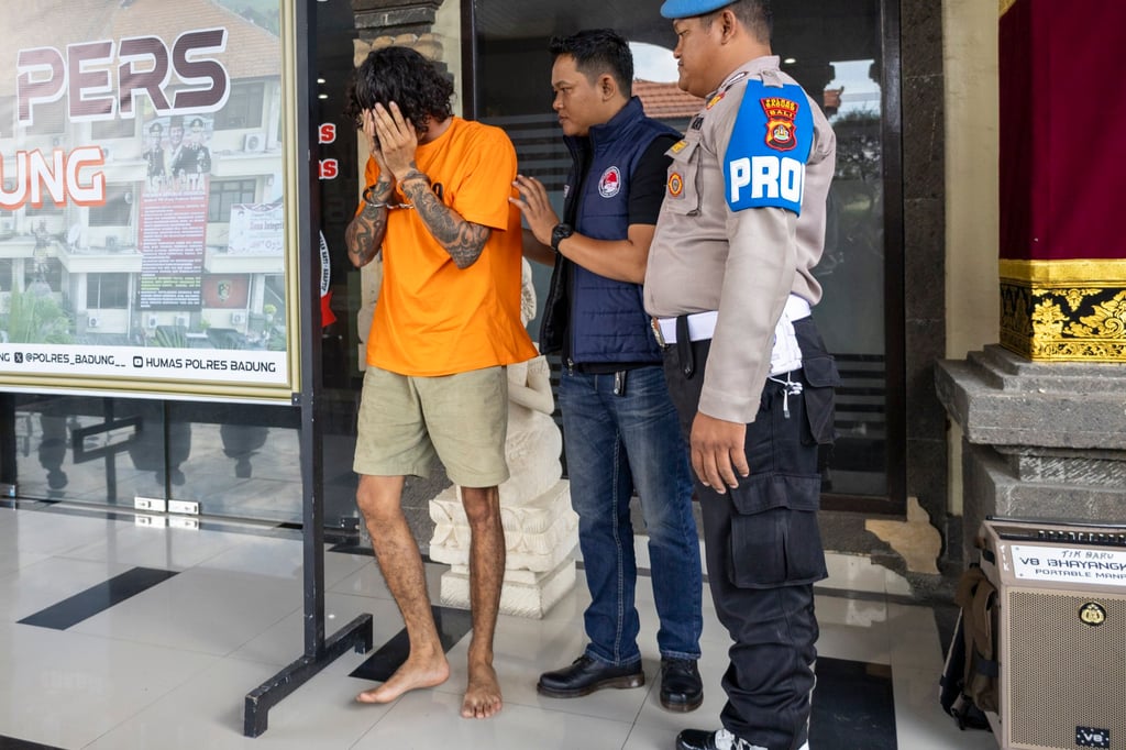 Australian national Nelson James is escorted by police during a press conference at a station in Badung, Bali, on June 14. He was arrested for alleged drug possession. Photo: EPA-EFE Australian national Nelson James is escorted by police during a press conference at a station in Badung, Bali, on June 14. He was arrested for alleged drug possession. Photo: EPA-EFE