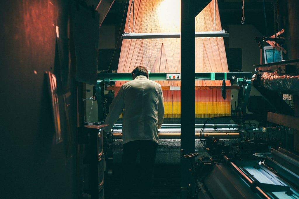 A craftsman at work at the 337-year-old Kyoto textile house Hosoo. Photo: courtesy Hosoo