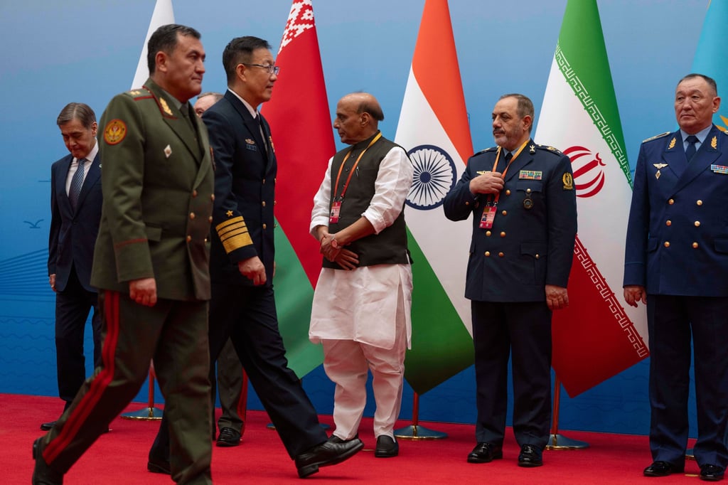 Chinese Defense Minister Dong Jun walks near Iran Defence Minister Aziz Nasirzadeh, second right, as they attend a group photo ahead a Shanghai Cooperation Organisation meeting in Qingdao on Thursday. Photo: AP Chinese Defense Minister Dong Jun walks near Iran Defence Minister Aziz Nasirzadeh, second right, as they attend a group photo ahead a Shanghai Cooperation Organisation meeting in Qingdao on Thursday. Photo: AP