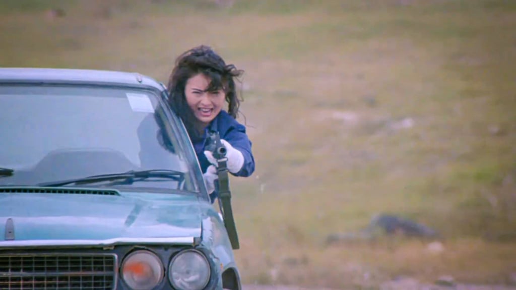 Moon Lee with the requisite firearm in Fatal Termination. Photo: Golden Sun Films Moon Lee with the requisite firearm in Fatal Termination. Photo: Golden Sun Films