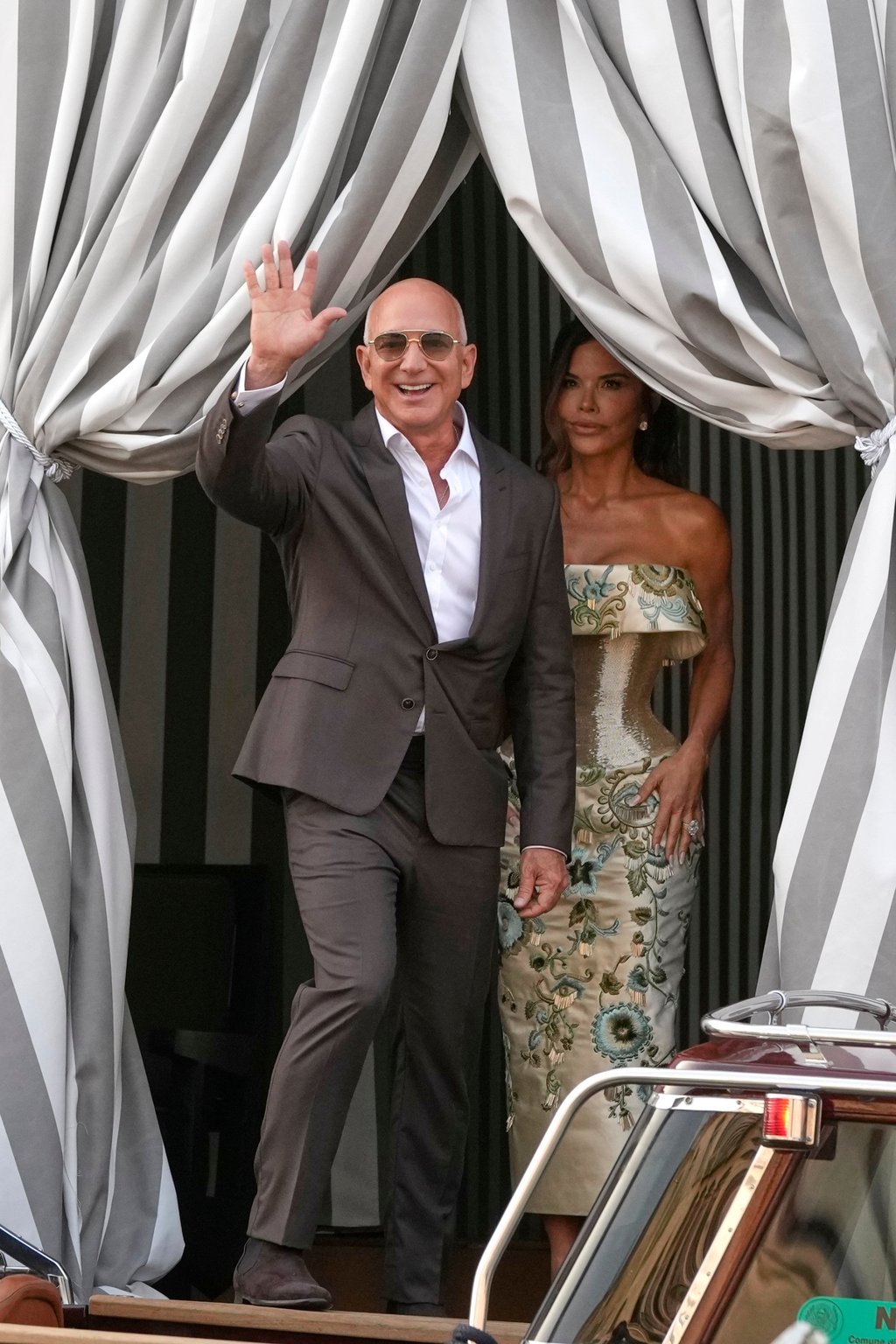 Lauren Sánchez left Venice’s Aman hotel on June 26 in a gold corset dress by Schiaparelli, while husband-to-be Jeff Bezos kept it simple in a charcoal suit. Photo: AP